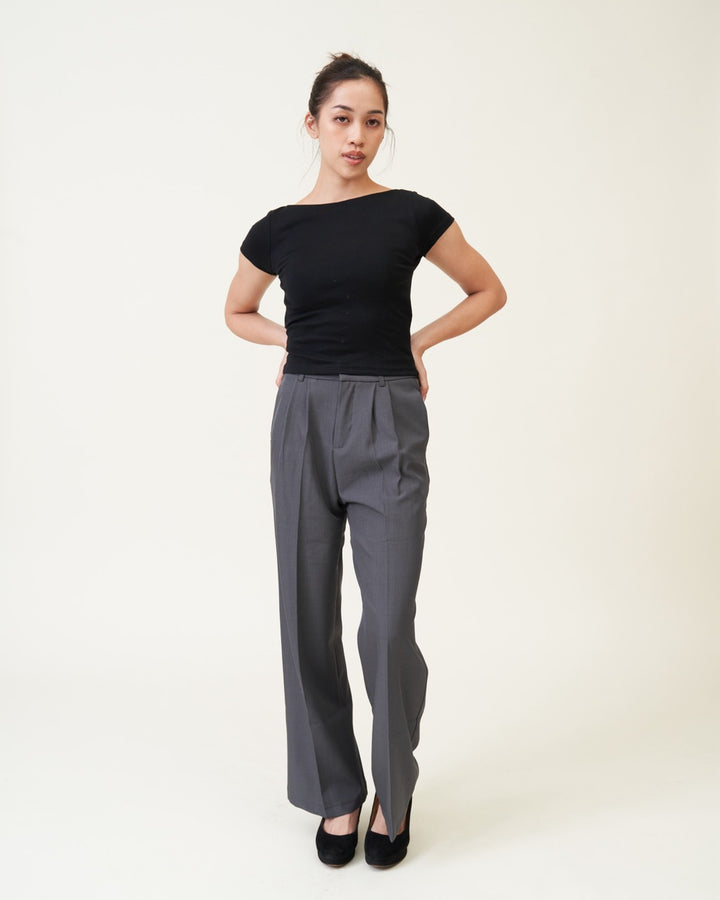Black Padded Chic Baby Tee worn with grey wide-leg trousers