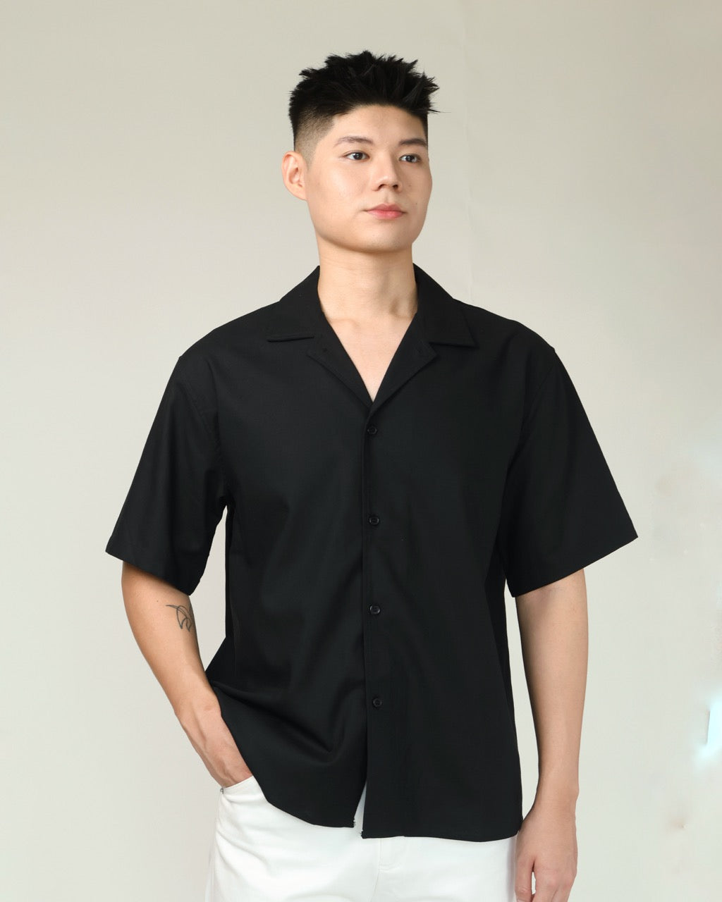 Holiday Cuban Shirt in Black showing the open collar, relaxed body and short sleeves.