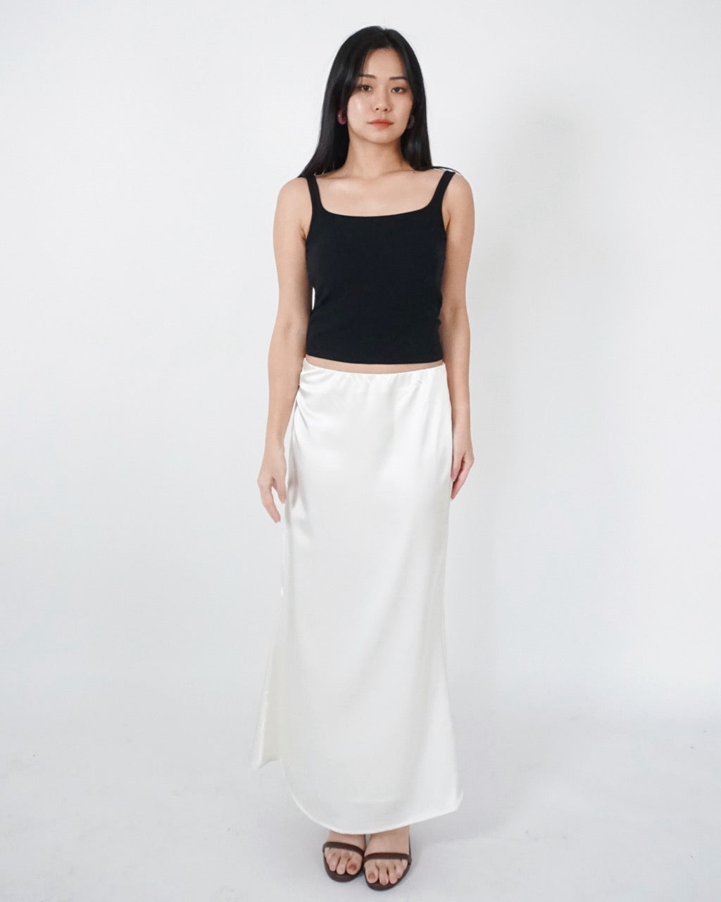 Flowy Satin Skirt in Pearl White, showing its flowing mermaid shape