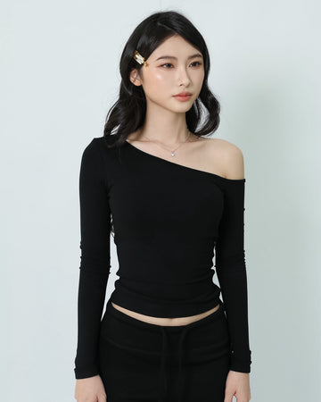 Chic Padded Off-shoulder in Black, showing the slanted neckline, long sleeves and body-fit cut.